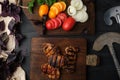 grilled pieces of pork meat, next to a board with chopped fresh vegetables Royalty Free Stock Photo