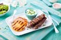 Grilled pineapple, lamb kebabs and coconut yogurt sauce Royalty Free Stock Photo