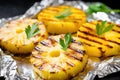 grilled pineapple slices on a foil