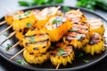 grilled pineapple slices on a skewer