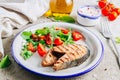 Grilled Pink salmon steak and salad on concrete background. Healthy food concept Royalty Free Stock Photo