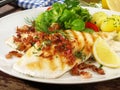 Grilled Plaice Fish Fillet with Bacon and Lemon Royalty Free Stock Photo