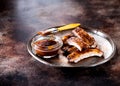 Grilled pork baby ribs with barbecue sauce