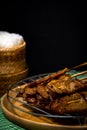 Grilled pork on bamboo skewers placed Royalty Free Stock Photo