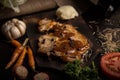 Grilled pork barbecue steak and side dishs on cutting board and wine on dark background Royalty Free Stock Photo