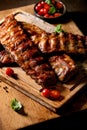 Grilled pork bbq ribs served with cherry tomatoes Royalty Free Stock Photo