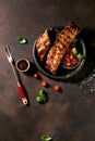 Grilled pork bbq ribs served with cherry tomatoes Royalty Free Stock Photo