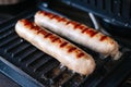 Grilled pork and beef sausages. Close the barbecue at home. Royalty Free Stock Photo