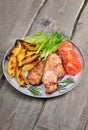 Grilled pork chop on rustic table Royalty Free Stock Photo