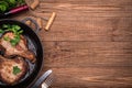 Grilled pork chop with spices in a frying pan. Royalty Free Stock Photo