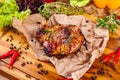 Grilled pork chop with spices and herbs on parchment paper Royalty Free Stock Photo