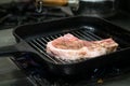 Grilled pork chop .Steak on a frying pan Royalty Free Stock Photo