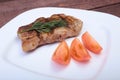 Grilled pork chop with vegetable on plate on wooden board Royalty Free Stock Photo