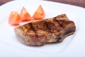 Grilled pork chop with vegetable on plate on wooden board Royalty Free Stock Photo