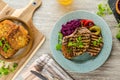 Grilled pork chops with herbs and garlic, potato pancakes Royalty Free Stock Photo