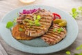 Grilled pork chops with herbs and garlic, potato pancakes Royalty Free Stock Photo