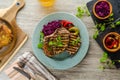 Grilled pork chops with herbs and garlic, potato pancakes Royalty Free Stock Photo