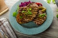 Grilled pork chops with herbs and garlic, potato pancakes Royalty Free Stock Photo