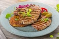 Grilled pork chops with herbs and garlic, potato pancakes Royalty Free Stock Photo