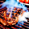 Grilled pork chops steak on the barbecue grill. Generative AI Royalty Free Stock Photo