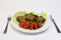 Grilled pork chops with tomatoes and lettuce