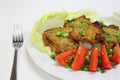 Grilled pork chops with tomatoes and lettuce