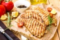 Grilled pork escalopes with rosemary and cherry tomatoes Royalty Free Stock Photo