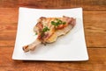 Grilled pork loin chop bone-in on dish on table Royalty Free Stock Photo