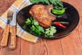 Grilled pork loin chop bone-in on dish, fork, knife Royalty Free Stock Photo