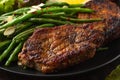 Grilled pork loin chops served with French green beans salad and beer Royalty Free Stock Photo