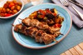 Grilled pork meat shashlik with sauteed vegetables