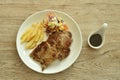 Grilled pork neck steak with french fries and salad dressing mayonnaise on plate dipping spicy sauce