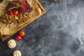 Grilled pork ribs, buckwheat with mushroom and tomatoes on vintage wooden cutting board. Flat lay, top view. Food frame, copy spac Royalty Free Stock Photo