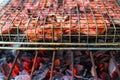 Grilled pork ribs on fireplace closeup photo. Red meat barbecue cooking.