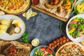 Grilled pork ribs, pizza, salad, fish and sausages with potatoes. Flat lay. Top view Royalty Free Stock Photo