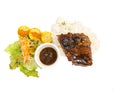 Grilled pork ribs with rice and fresh vegetables and corn on a white background Royalty Free Stock Photo