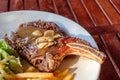 Grilled pork ribs steak well-done with french fries and vegetable Royalty Free Stock Photo