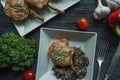 Grilled pork ribs steaks with spices and herbs. Decorated with fresh Bulgarian pepper, cherry tomatoes, lettuce, curly parsley. Royalty Free Stock Photo