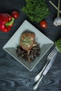 Grilled pork ribs steaks with spices and herbs. Decorated with fresh Bulgarian pepper, cherry tomatoes, lettuce, curly parsley. Royalty Free Stock Photo