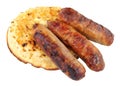 Grilled Pork Sausages On A Buttered Crumpet Royalty Free Stock Photo