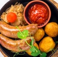 Grilled pork sausages with potato