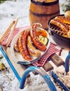Grilled pork sausages at a winter barbecue