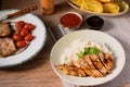 Grilled pork served on top of steamed rice Royalty Free Stock Photo