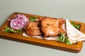 Grilled pork skewers with pita bread and herbs on a wooden board. Royalty Free Stock Photo