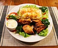 Grilled pork slices, potatoes in a glass bowl and assorted fresh vegetables salad Royalty Free Stock Photo