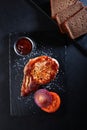 Grilled pork steak on a black background. Pork chops. Royalty Free Stock Photo