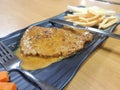 Grill pork steak with frech fries on dish background