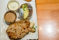 Grilled pork steak , French fries and vegetables. Assorted meat from pork and various vegetables on barbecue grill cooked Royalty Free Stock Photo