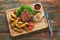 Grilled pork steak with potato wedges top view Royalty Free Stock Photo