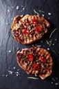 Grilled pork steaks with chili peppers and spices Royalty Free Stock Photo